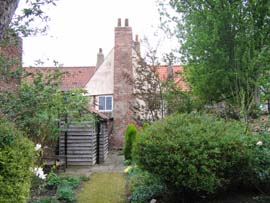 A rear view of 51 Fleetgate looking through the garden.