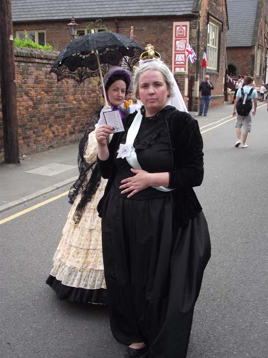 Queen Victoria and a very elegant Victorian Lady
