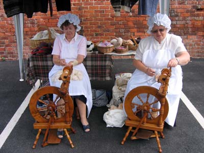 Ladies hard at work spinning and weaving