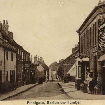 Fleetgate postcard showing A and E Newham shop - now Clarkes Shoes. The demolished Waggon and Horses is on the left
